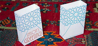 A pair of bag cards with a continuous design