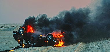 A car burning following a crash on the North Road