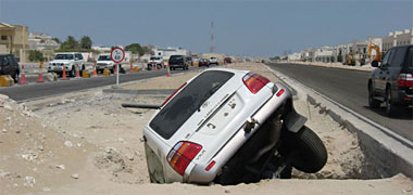 A new car in a hole in the median