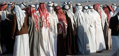 Dancers at a razeef wearing a mixture of summer the heavier winter thubs