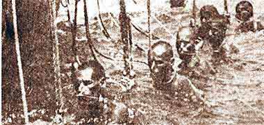 Divers resting in the water between dives – photograph from an old newspaper