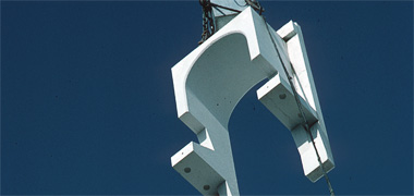 A pre-cast concrete element being swung into position, December 1983