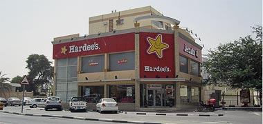 Qatar Education City convention building by Arata IsozaAn advertisement for a fast food outlet