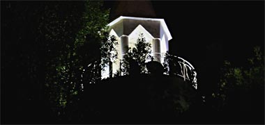 The top of a minaret, seen by night