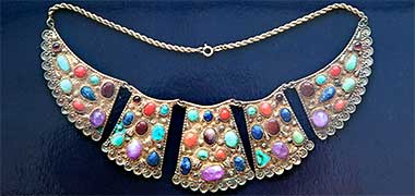 A decorative necklace – from a Ministry of Information poster