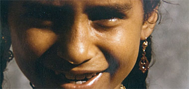 A young Yemeni girl in Qatar wearing earrings