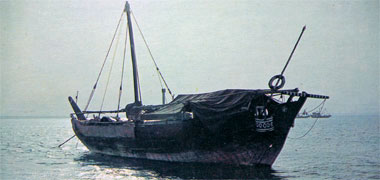 A boom sitting at anchor in Doha Bay