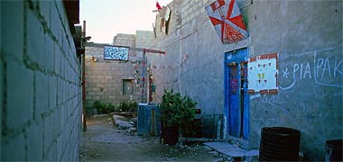 A traditional entrance gate with blank wall opposite