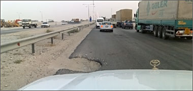 A deep pothole in the fast lane