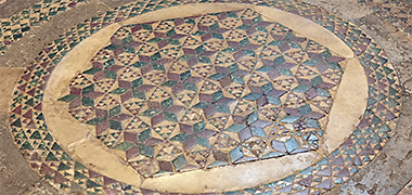 Detail of the roundel in the north-west corner of the pavement, 2024