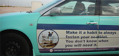 A taxi with mis-spelled sign