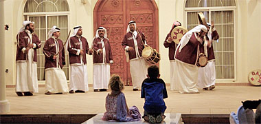 A traditional music group on stage