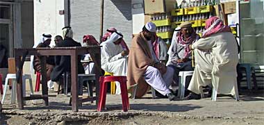 Men relaxing at a café