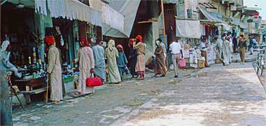 A view of shops on the west side of Suq Waqf street in March 1972